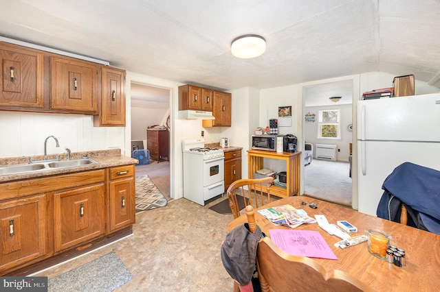 15-17 Locust St, Duncannon, PA 17020 - kitchen with white appliances, a sink, brown cabinetry, and light countertops