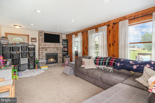 28 Laudermilch Rd, Halifax, PA 17032 - living room featuring carpet floors, a stone fireplace, recessed lighting, and wooden walls