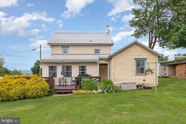 28 Laudermilch Rd, Halifax, PA 17032 - rear view of house with a deck, a lawn, and metal roof