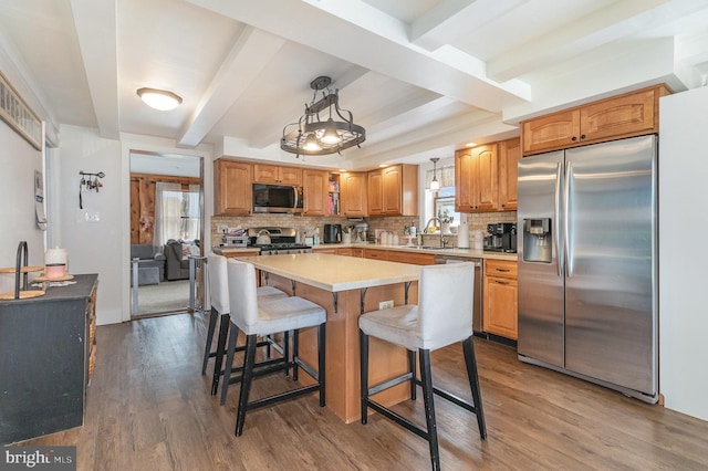 28 Laudermilch Rd, Halifax, PA 17032 - kitchen featuring stainless steel appliances, tasteful backsplash, dark wood-type flooring, beamed ceiling, and a sink