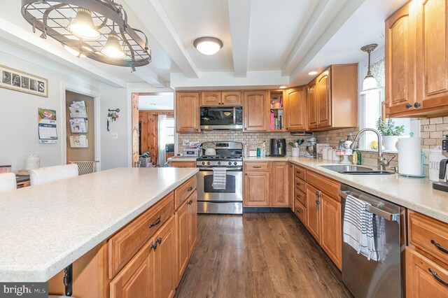 28 Laudermilch Rd, Halifax, PA 17032 - kitchen featuring stainless steel appliances, a sink, decorative backsplash, dark wood-style flooring, and light countertops