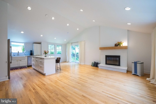 549 E Lafayette Dr, West Chester, PA 19382 - kitchen featuring stainless steel dishwasher, a center island, a kitchen breakfast bar, light countertops, and open floor plan