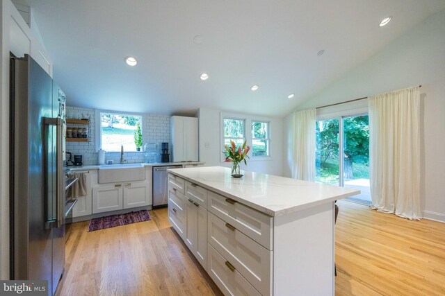 549 E Lafayette Dr, West Chester, PA 19382 - kitchen featuring appliances with stainless steel finishes, light wood-type flooring, backsplash, a kitchen island, and recessed lighting