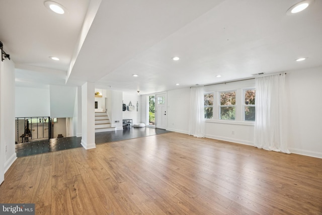 549 E Lafayette Dr, West Chester, PA 19382 - unfurnished living room with stairway, hardwood / wood-style floors, and recessed lighting