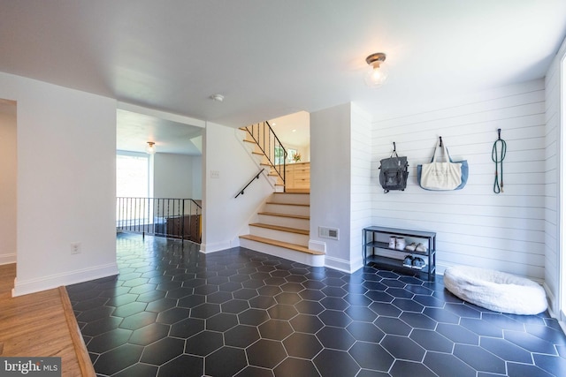 549 E Lafayette Dr, West Chester, PA 19382 - unfurnished living room featuring stairs and wood walls