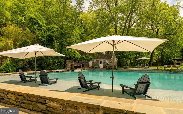 11 Conshohocken State Rd, Gladwyne, PA 19035 - outdoor pool featuring an outdoor structure and a patio area