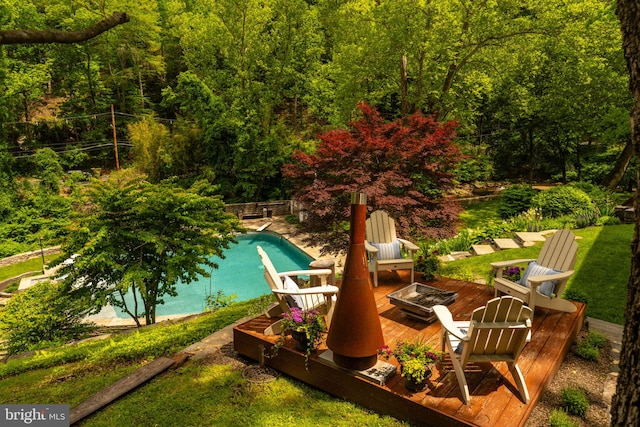 11 Conshohocken State Rd, Gladwyne, PA 19035 - view of pool with a fire pit, a deck, and a view of trees