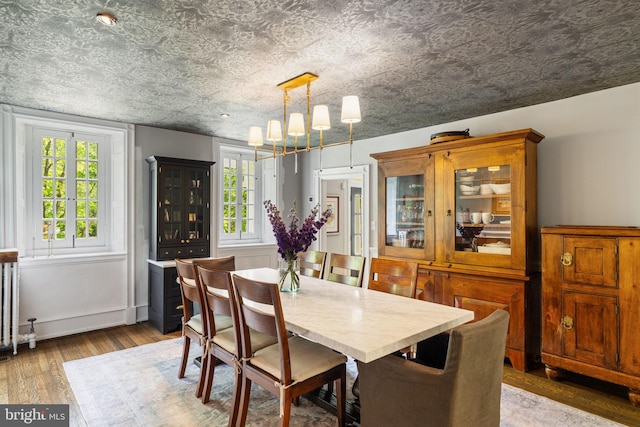 11 Conshohocken State Rd, Gladwyne, PA 19035 - dining room with a chandelier, wood finished floors, and plenty of natural light