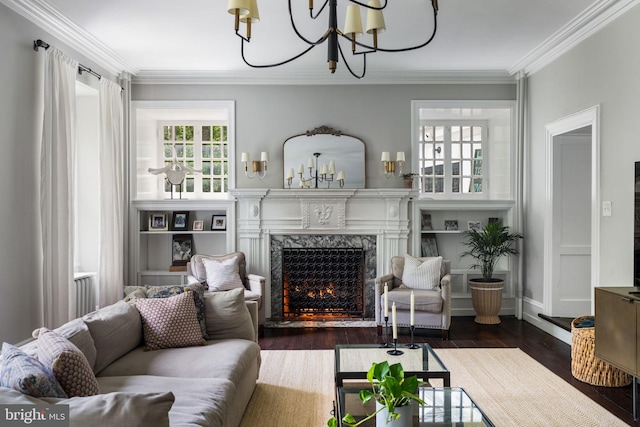 11 Conshohocken State Rd, Gladwyne, PA 19035 - living area with a chandelier, a high end fireplace, ornamental molding, and wood finished floors