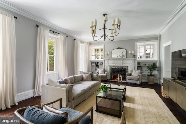 11 Conshohocken State Rd, Gladwyne, PA 19035 - living area with a premium fireplace, a chandelier, ornamental molding, dark wood-style floors, and baseboards