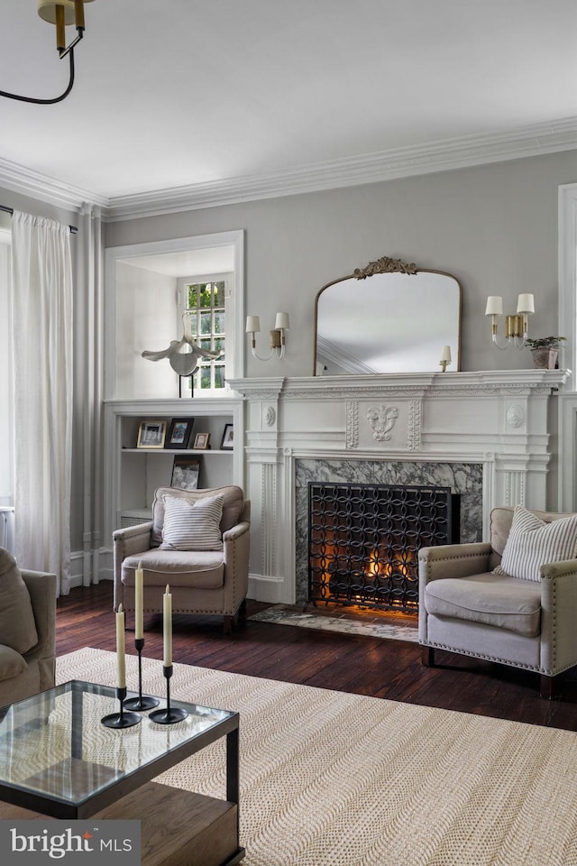 11 Conshohocken State Rd, Gladwyne, PA 19035 - living room featuring a premium fireplace, wood finished floors, and ornamental molding