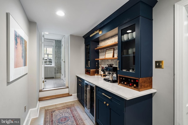 11 Conshohocken State Rd, Gladwyne, PA 19035 - bar area featuring beverage cooler, light tile patterned floors, baseboards, radiator heating unit, and recessed lighting