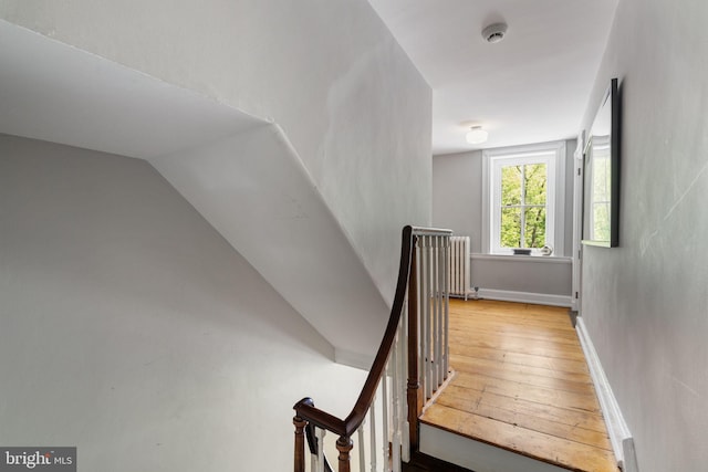 11 Conshohocken State Rd, Gladwyne, PA 19035 - stairway featuring radiator heating unit, wood-type flooring, lofted ceiling, and baseboards