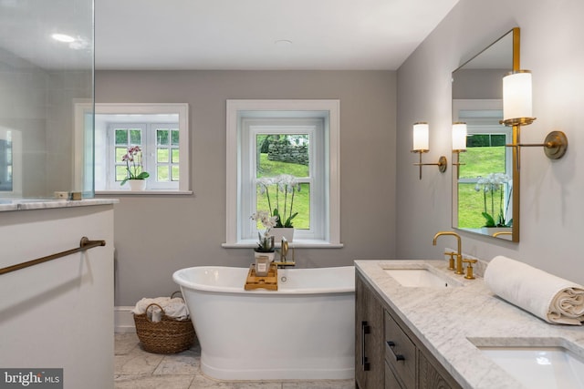 11 Conshohocken State Rd, Gladwyne, PA 19035 - bathroom featuring a freestanding tub, double vanity, and baseboards