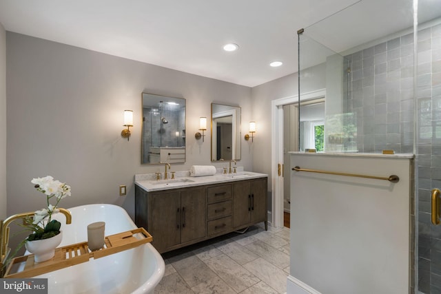 11 Conshohocken State Rd, Gladwyne, PA 19035 - bathroom featuring a freestanding bath, double vanity, tiled shower, and recessed lighting