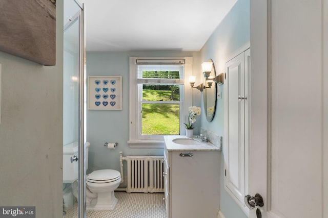 11 Conshohocken State Rd, Gladwyne, PA 19035 - full bath featuring radiator heating unit, vanity, toilet, tile patterned flooring, and a shower with shower door