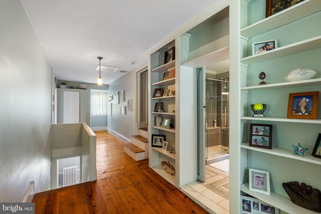 11 Conshohocken State Rd, Gladwyne, PA 19035 - corridor with hardwood / wood-style floors, baseboards, built in features, and an upstairs landing