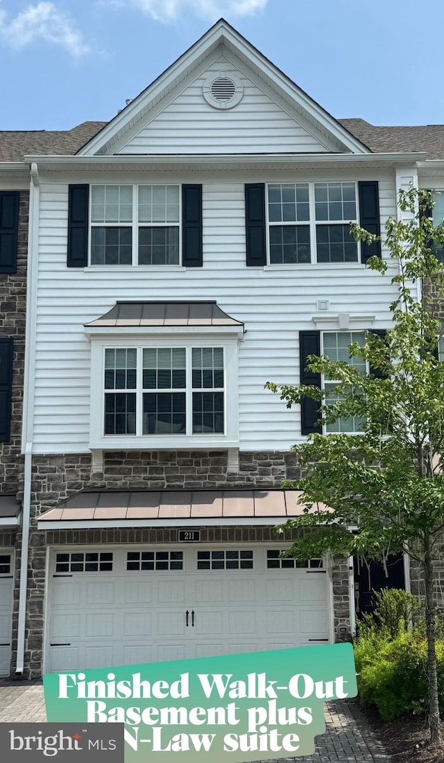 211 Corvus Cir Unit 128, Media, PA 19063 - view of front of house with an attached garage, stone siding, and roof with shingles