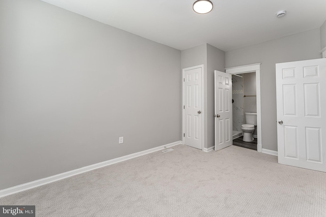 1607 Saint Stephens St, Baltimore, MD 21216 - unfurnished bedroom featuring light carpet, baseboards, and ensuite bath