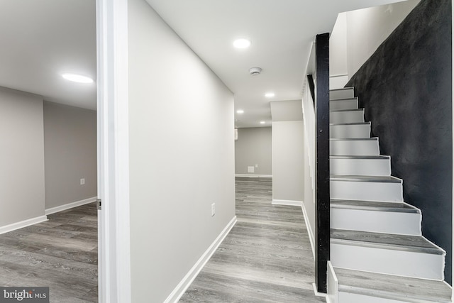 1607 Saint Stephens St, Baltimore, MD 21216 - stairs with wood finished floors, baseboards, and recessed lighting