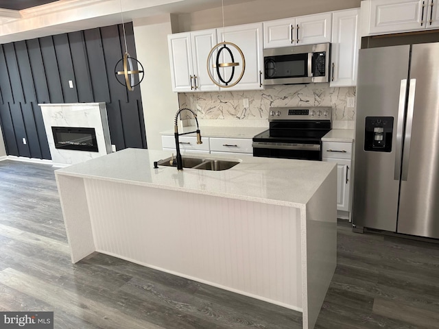 1607 Saint Stephens St, Baltimore, MD 21216 - kitchen with stainless steel appliances, a sink, dark wood-type flooring, and backsplash