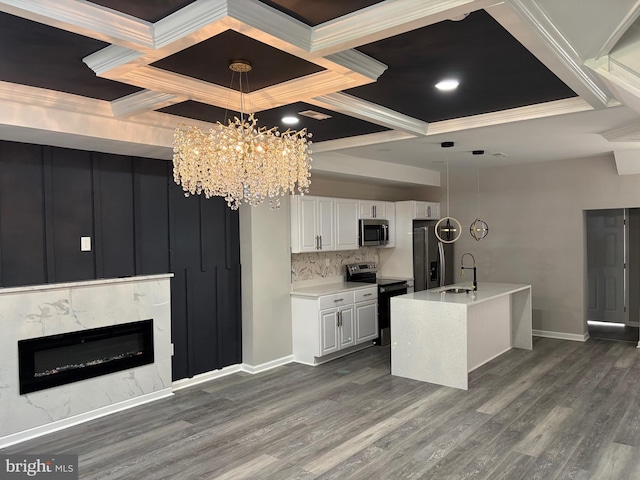 1607 Saint Stephens St, Baltimore, MD 21216 - kitchen featuring stainless steel microwave, range with electric stovetop, a sink, ornamental molding, and coffered ceiling