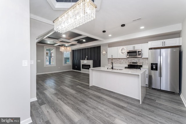 1607 Saint Stephens St, Baltimore, MD 21216 - kitchen featuring stainless steel appliances, a chandelier, crown molding, a sink, and white cabinetry