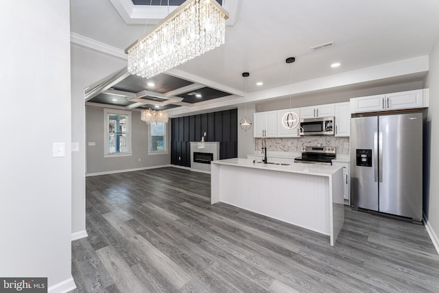 1607 Saint Stephens St, Baltimore, MD 21216 - kitchen featuring appliances with stainless steel finishes, a chandelier, crown molding, dark wood-style floors, and white cabinets