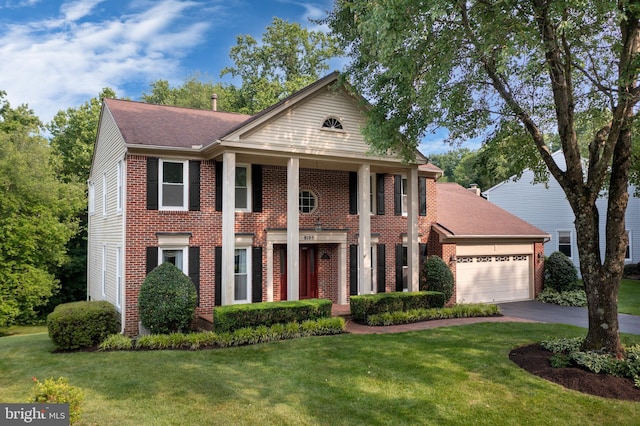 8105 Overlake Ct, Fairfax Station, VA 22039 - greek revival inspired property featuring brick siding, an attached garage, a front lawn, and asphalt driveway