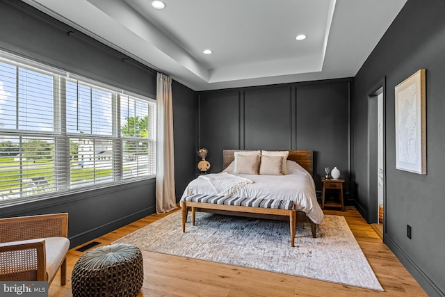 597 Zion Rd, Egg Harbor Township, NJ 08234 - bedroom featuring a tray ceiling, light wood-type flooring, recessed lighting, and baseboards