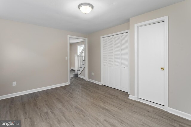 16 Woodside Ln, Keansburg, NJ 07734 - unfurnished bedroom featuring baseboards, wood finished floors, and a closet