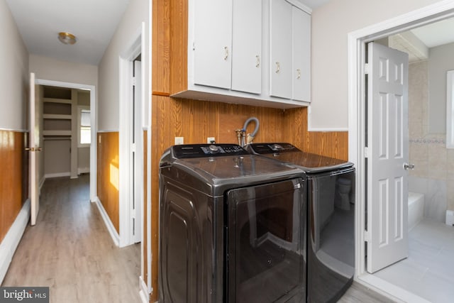 16 Woodside Ln, Keansburg, NJ 07734 - laundry area with cabinet space, washer and clothes dryer, wainscoting, and light wood-style flooring