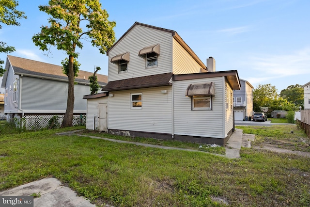 16 Woodside Ln, Keansburg, NJ 07734 - back of house with a chimney and crawl space