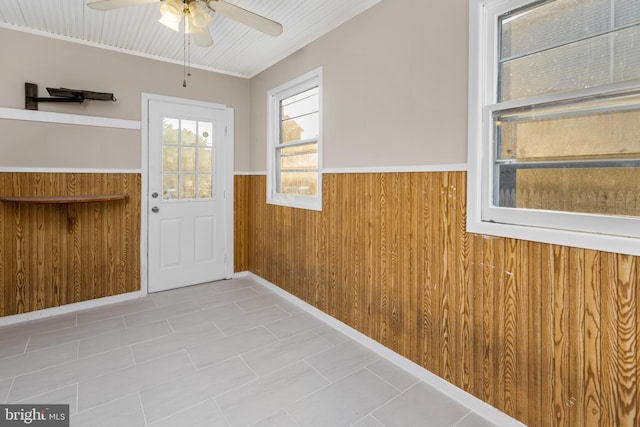 16 Woodside Ln, Keansburg, NJ 07734 - entryway with a wainscoted wall, a ceiling fan, and wooden walls