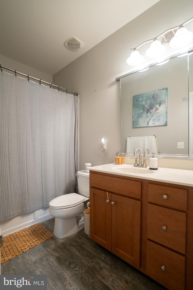 20468 Alicent Ter, Ashburn, VA 20147 - bathroom featuring vanity, wood finished floors, and a shower with shower curtain