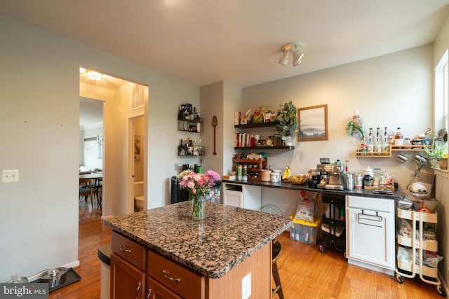 20468 Alicent Ter, Ashburn, VA 20147 - kitchen with open shelves, light wood-style flooring, and dark stone counters