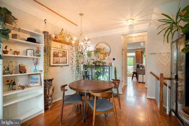 20468 Alicent Ter, Ashburn, VA 20147 - dining area with wood finished floors, ornamental molding, and a chandelier