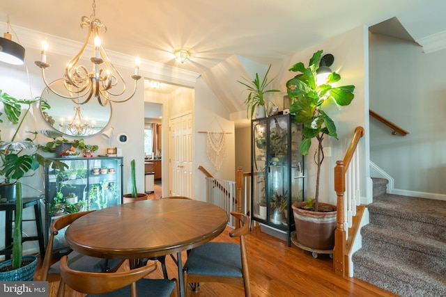 20468 Alicent Ter, Ashburn, VA 20147 - dining room with a chandelier, crown molding, wood finished floors, and stairway