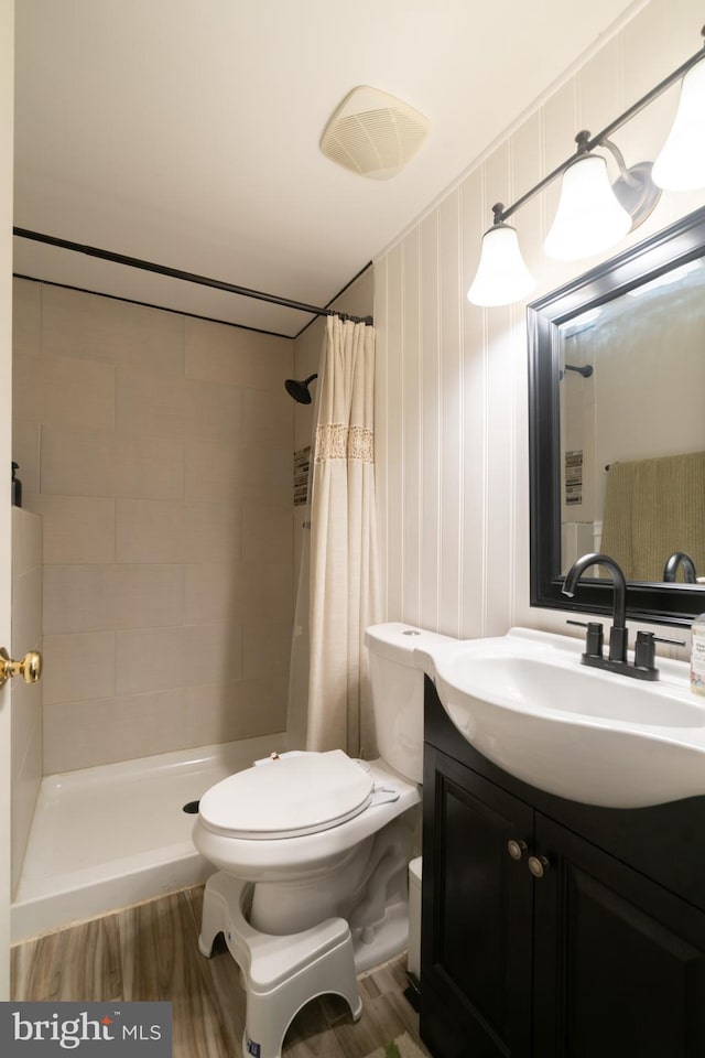 20468 Alicent Ter, Ashburn, VA 20147 - full bathroom with vanity, tiled shower, and wood finished floors