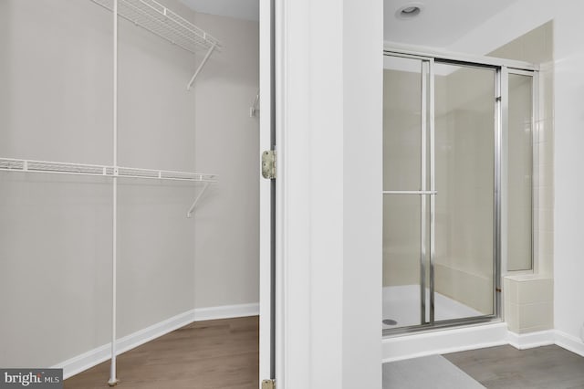 1813 Wheyfield Dr Unit 10-A, Frederick, MD 21701 - full bath with a shower stall, a walk in closet, and wood finished floors