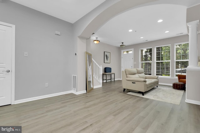 1813 Wheyfield Dr Unit 10-A, Frederick, MD 21701 - living area with light wood finished floors, arched walkways, ornate columns, stairway, and recessed lighting