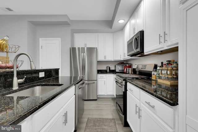 1813 Wheyfield Dr Unit 10-A, Frederick, MD 21701 - kitchen with stainless steel appliances, white cabinets, recessed lighting, dark stone countertops, and light wood-type flooring