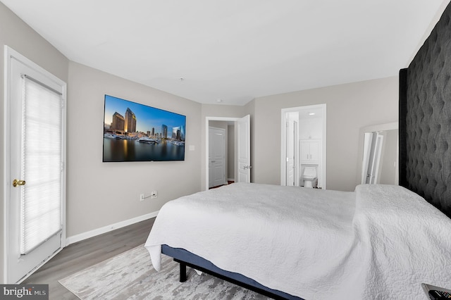 1813 Wheyfield Dr Unit 10-A, Frederick, MD 21701 - bedroom featuring wood finished floors, multiple windows, and ensuite bathroom