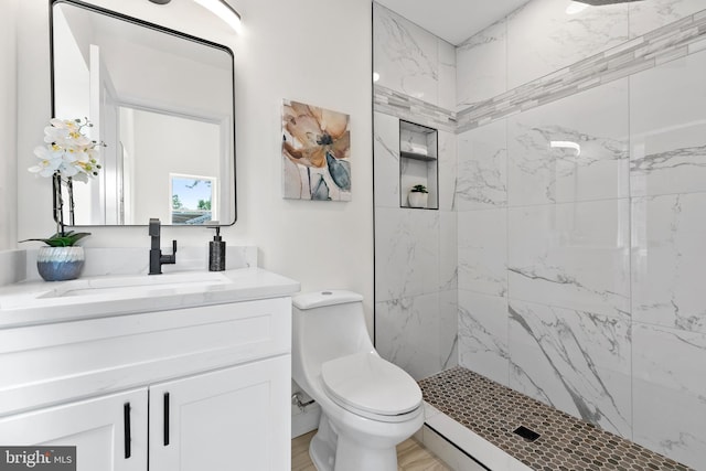 713 Tewkesbury Pl NW, Washington, DC 20012 - full bath with vanity, a marble finish shower, and toilet
