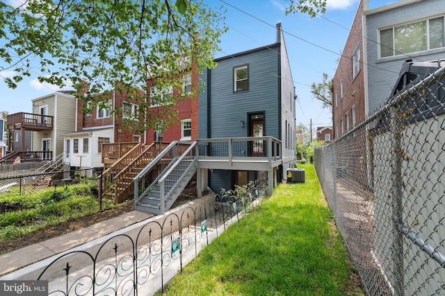 713 Tewkesbury Pl NW, Washington, DC 20012 - rear view of property featuring central AC, stairway, and a deck