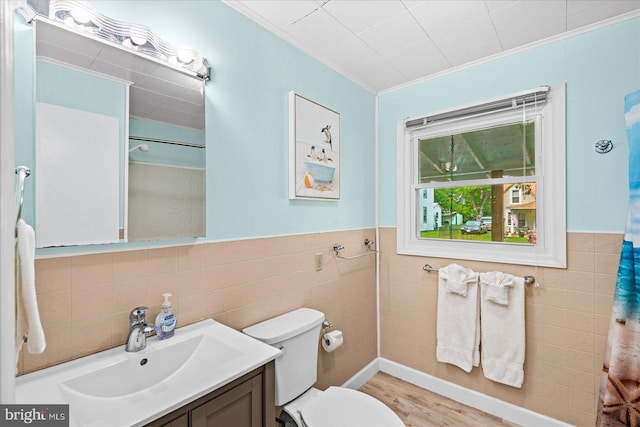 412 Marshall Ave, Colonial Beach, VA 22443 - full bathroom featuring tile walls, crown molding, vanity, toilet, and wood finished floors