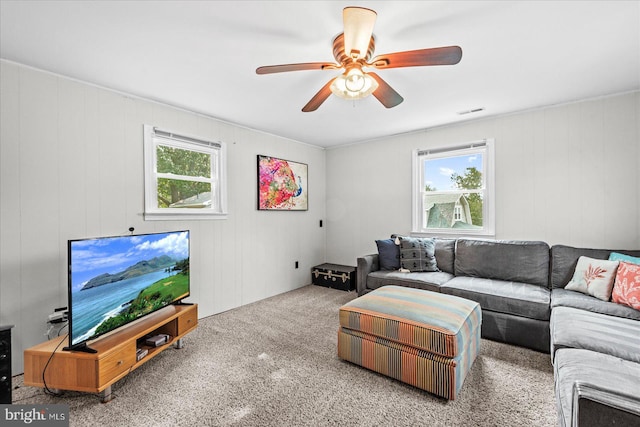 412 Marshall Ave, Colonial Beach, VA 22443 - carpeted living area with healthy amount of natural light and ceiling fan