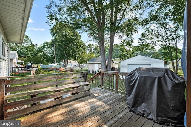 412 Marshall Ave, Colonial Beach, VA 22443 - deck featuring grilling area, an outdoor structure, and a detached garage