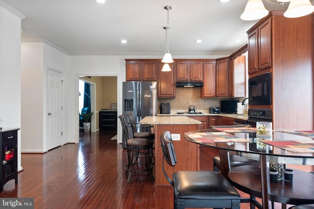 2652 Academic Ct, Waldorf, MD 20603 - kitchen with stainless steel fridge with ice dispenser, a center island, black microwave, decorative backsplash, and dark wood-style floors