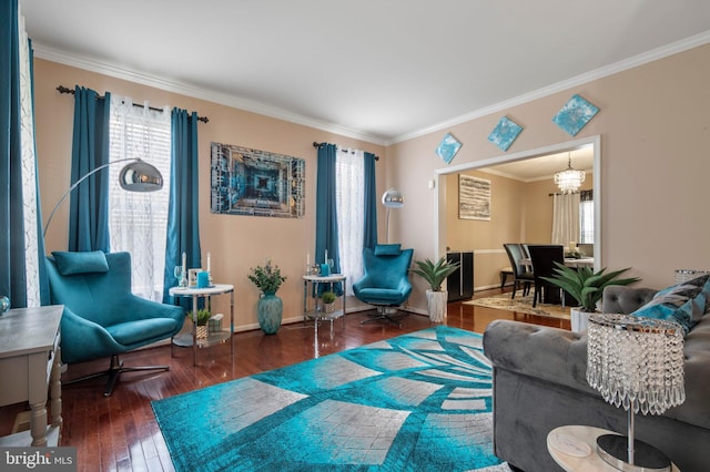 2652 Academic Ct, Waldorf, MD 20603 - living area with crown molding, plenty of natural light, a chandelier, hardwood / wood-style flooring, and baseboards